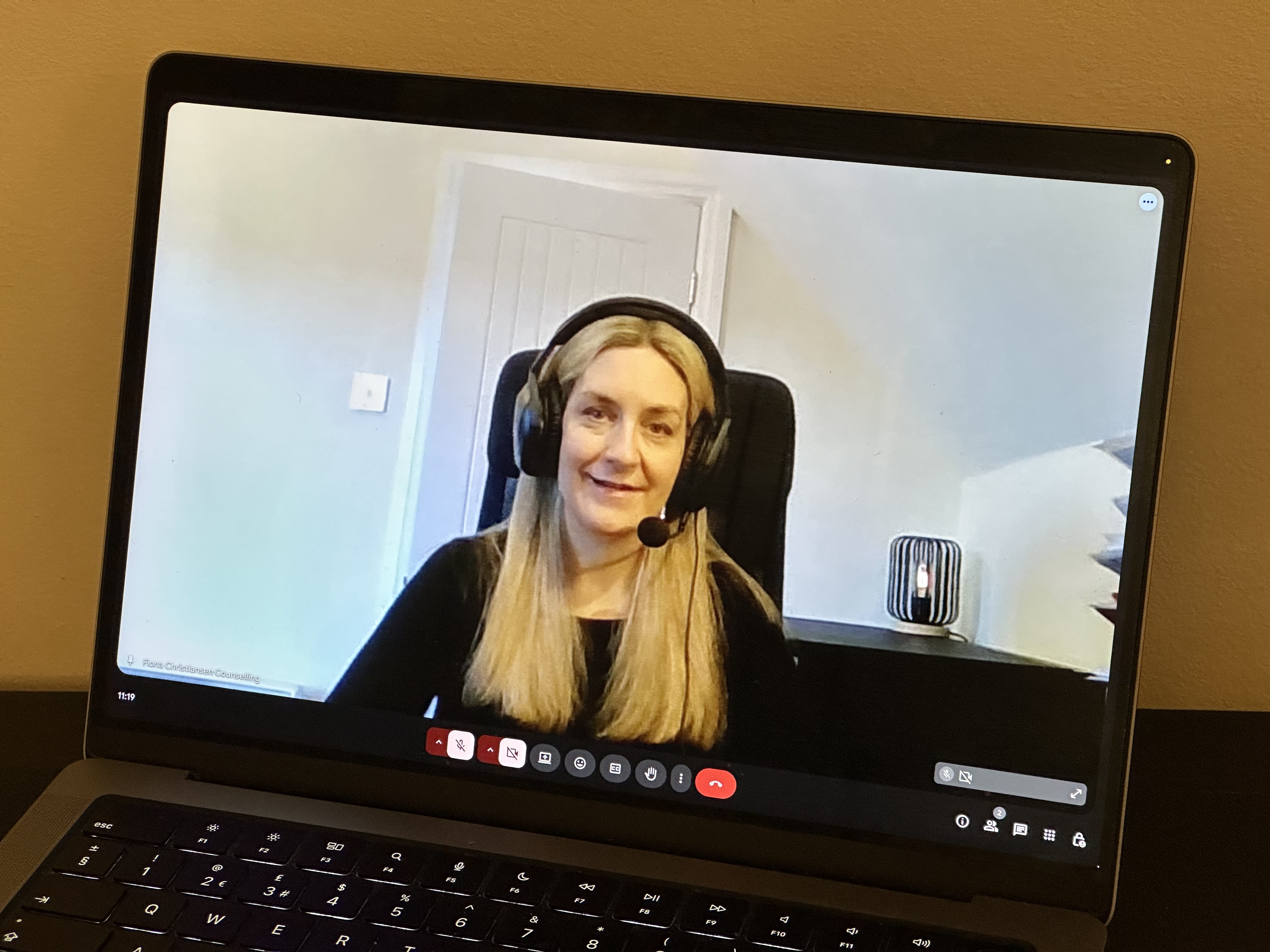 Portrait photo of Fiona Christiansen on a laptop screen